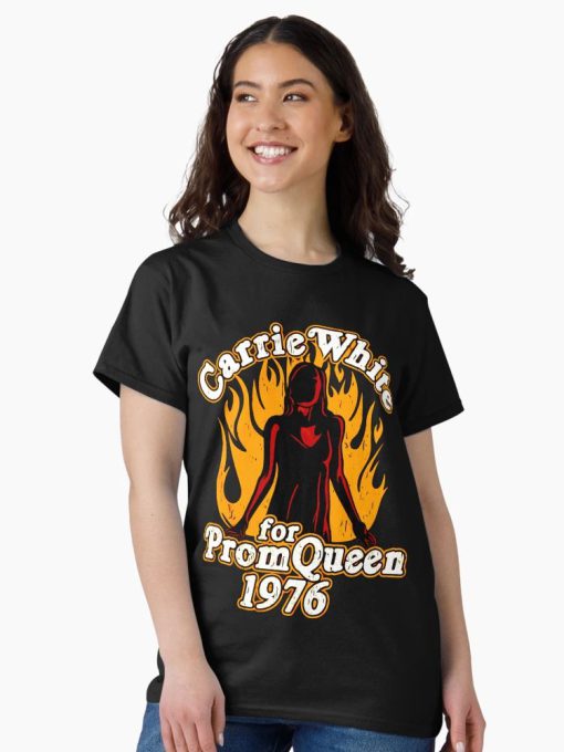 Black t-shirt with flaming silhouette of Carrie White and “Prom Queen 1976” vintage horror design
