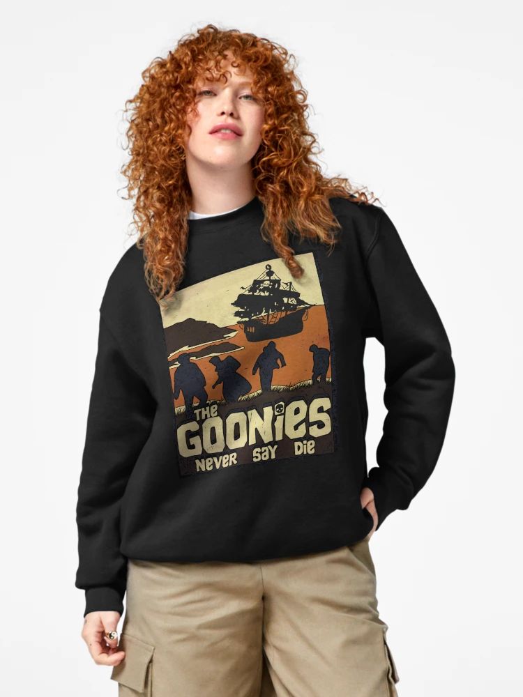 Black sweatshirt with retro sunset Goonies graphic and “Never Say Die” quote from 1980s adventure movie