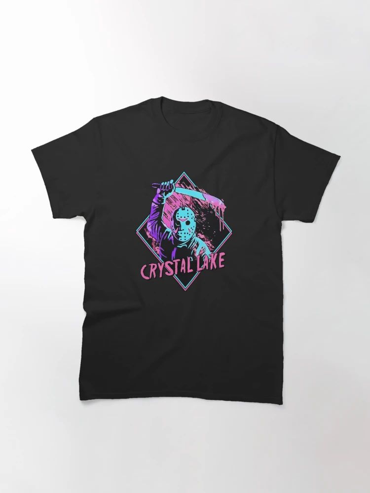 Black t-shirt with neon pink and blue design showing masked slasher holding machete, text reads “Crystal Lake
