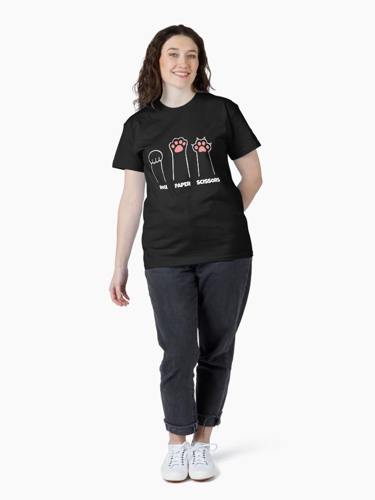 Black t-shirt featuring three illustrated cat paws labeled “Rock,” “Paper,” and “Scissors” in white and pink