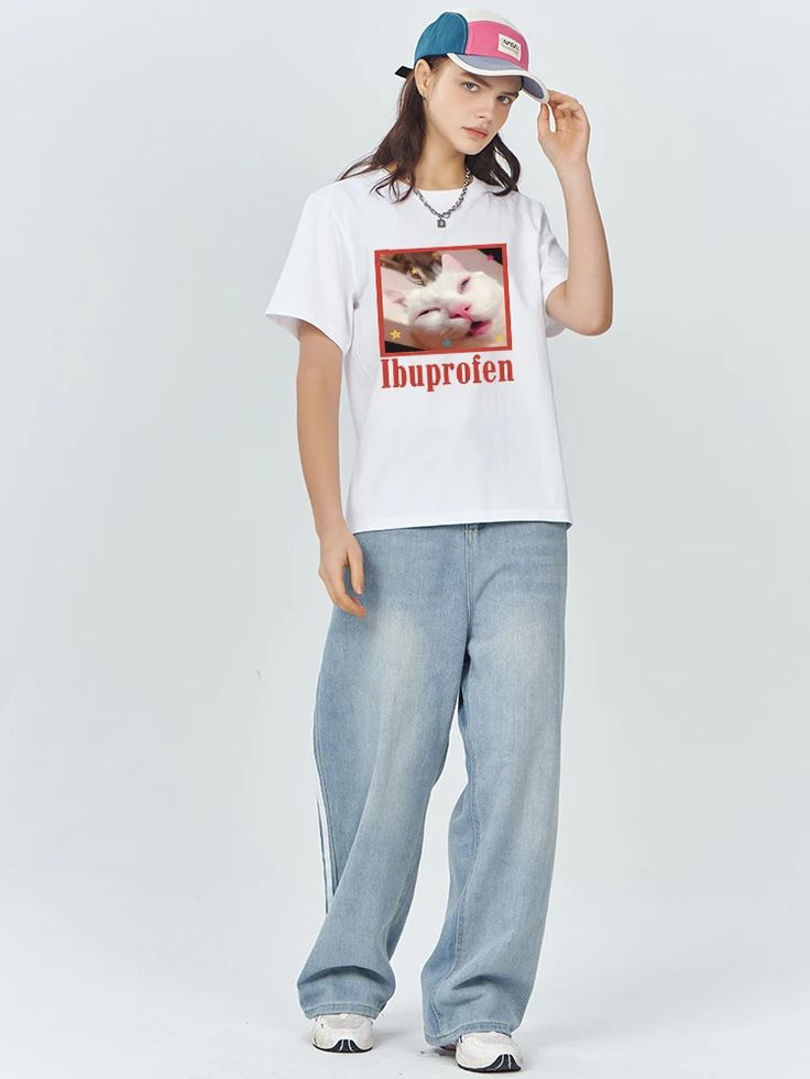Unisex Whitet-shirt with a colorful printed meme image of a sleepy white cat and the word “Ibuprofrén.”