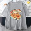 Grey t-shirt with a graphic of a fast food box labeled “Kitten Nuggets” filled with cat-shaped nuggets and dipping sauce.
