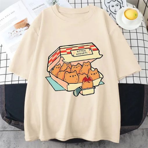 Sand t-shirt with a graphic of a fast food box labeled “Kitten Nuggets” filled with cat-shaped nuggets and dipping sauce.