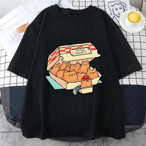 Black t-shirt with a graphic of a fast food box labeled “Kitten Nuggets” filled with cat-shaped nuggets and dipping sauce.