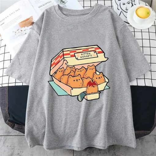 Grey t-shirt with a graphic of a fast food box labeled “Kitten Nuggets” filled with cat-shaped nuggets and dipping sauce.