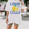 White oversized t-shirt with a lemon graphic and text “Limoncello – la dolce vita” in blue and yellow