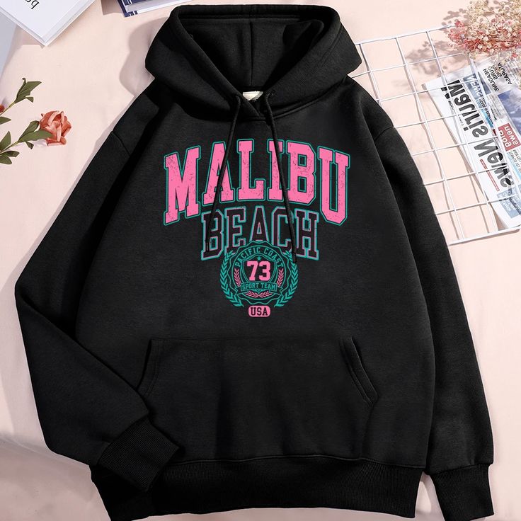 Malibu Beach Hoodie Unisex Streetwear Pullover with Retro Letter Print Black unisex hoodie with "Malibu Beach" pink and teal graphic print, kangaroo pocket, and drawstring hood
