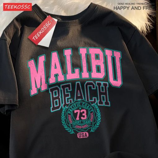Black unisex t-shirt featuring Malibu Beach retro-style print in varsity font with pink and teal colors.