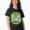 WOmen T-shirt with bold T-Rex skull logo inside a green badge reading “T-Rex Ranch.”