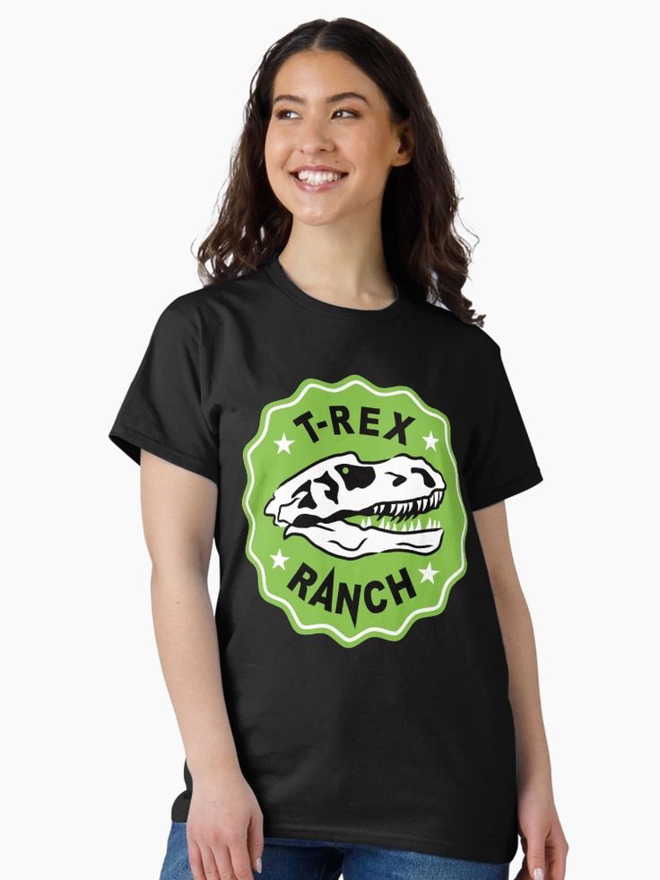 WOmen T-shirt with bold T-Rex skull logo inside a green badge reading “T-Rex Ranch.”