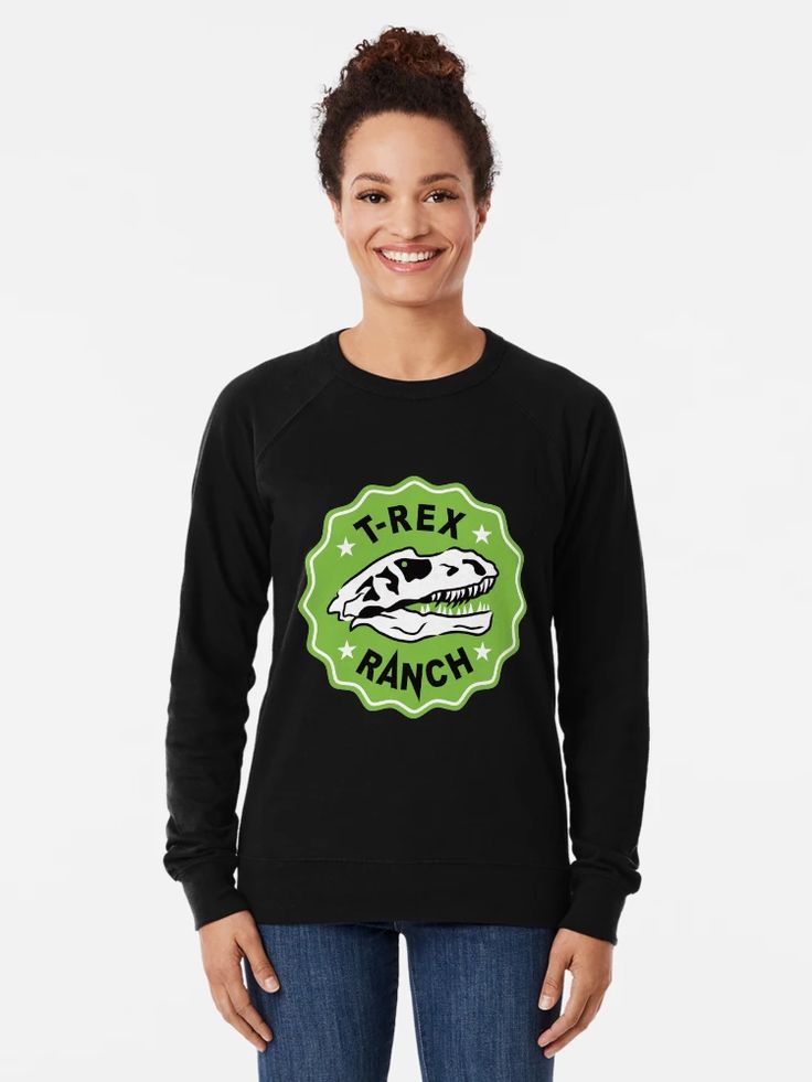 Women Black sweatshirt with a green badge graphic featuring a T-Rex skull and the words “T-Rex Ranch.”