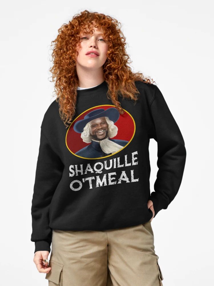 Black sweatshirt with “Shaquille O’Tmeal” graphic parody of a breakfast mascot featuring Shaq