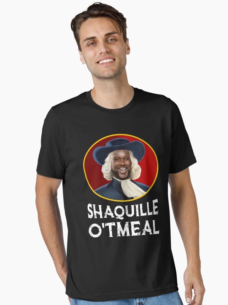 Black t-shirt featuring a cartoon-style image of Shaquille O'Neal dressed like an oatmeal mascot, with the text “Shaquille O’Tmeal.”