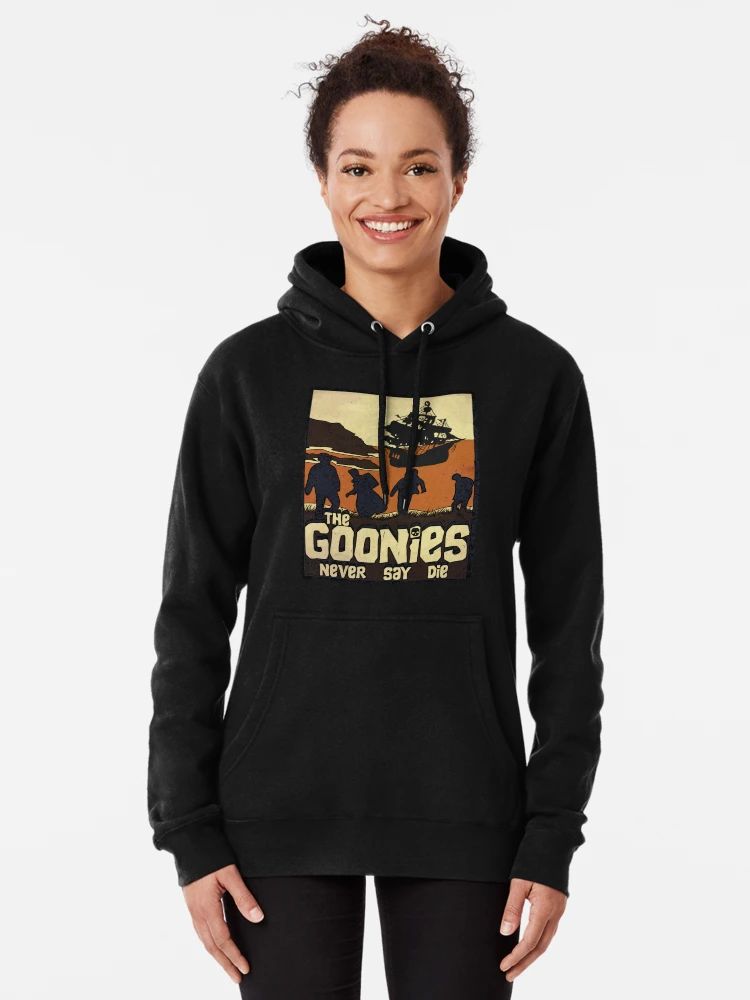 Black hoodie with Goonies silhouettes, pirate ship, and retro “Never Say Die” text for nostalgic movie fans