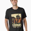 Black t-shirt featuring sunset silhouette of The Goonies crew and pirate ship with “The Goonies Never Say Die” text
