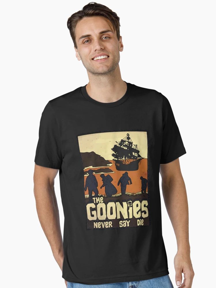 Black t-shirt featuring sunset silhouette of The Goonies crew and pirate ship with “The Goonies Never Say Die” text