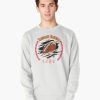 White sweatshirt with a football bursting through a graphic surrounded by red baseball stitches, labeled “Tennessee Baseball 1959,” worn by male model.