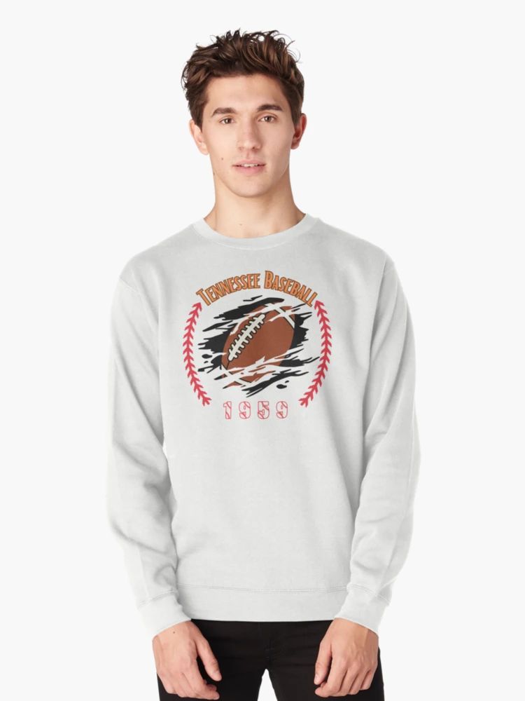 Tennessee Baseball 1959 Funny Retro Football Baseball Sweatshirt White sweatshirt with a football bursting through a graphic surrounded by red baseball stitches, labeled “Tennessee Baseball 1959,” worn by male model.