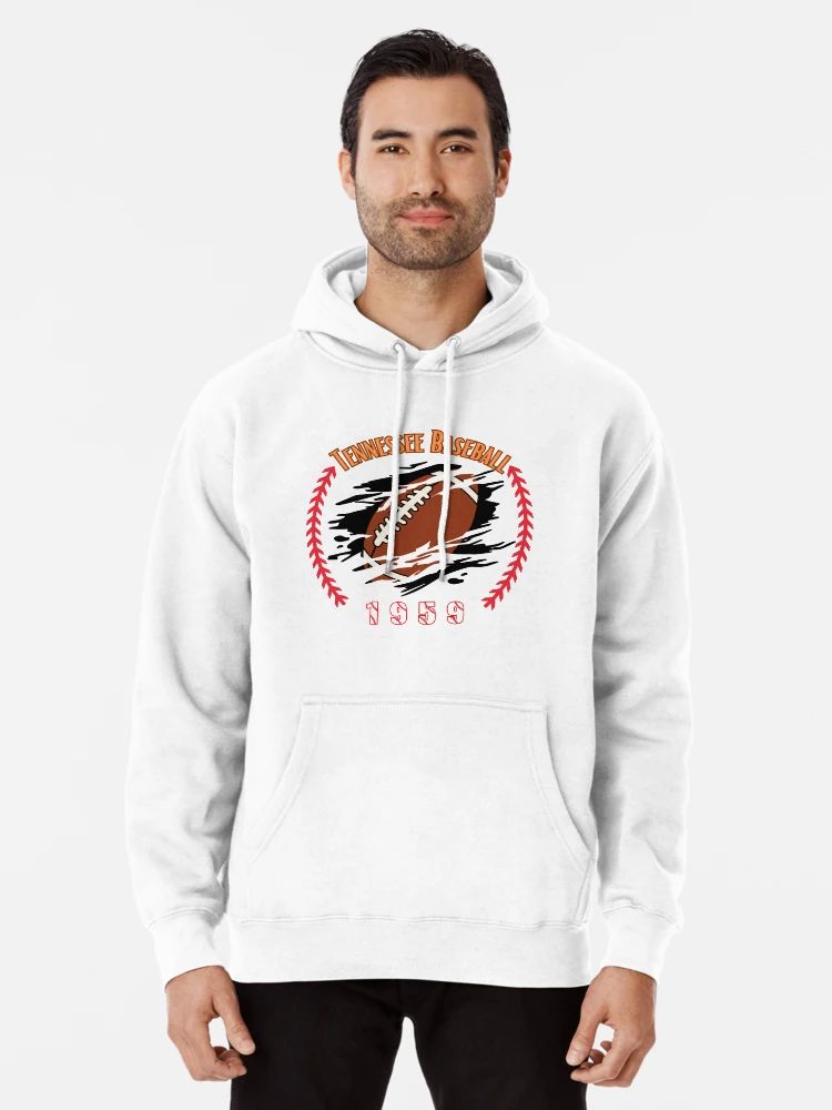 Tennessee Baseball 1959 Funny Retro Football Baseball Hoodie White Hoodie with a football bursting through a graphic surrounded by red baseball stitches, labeled “Tennessee Baseball 1959,” worn by male model.