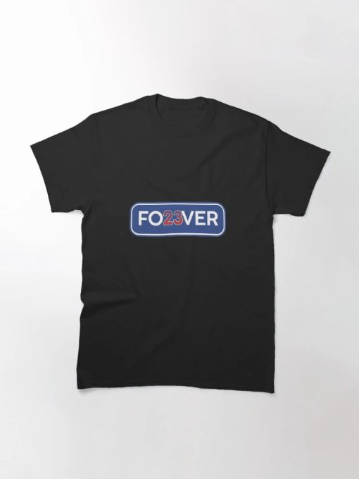Man wearing black T-Shirt with “FO23VER” design in blue and white with red 23 — tribute to Cubs legend Ryne Sandberg.