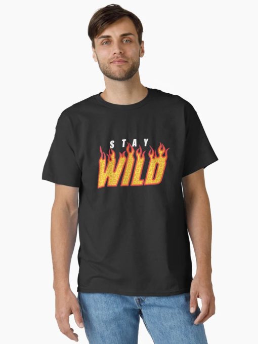 Men Black Tee with “Stay Wild” flame-text design in yellow and red, worn by a smiling male model