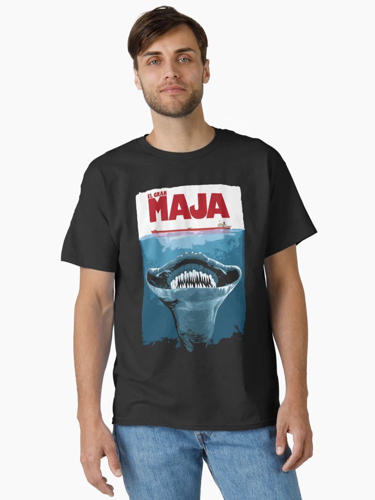 Black t-shirt with retro movie-poster design of a giant sea creature and “El Gran Maja” text in bold red letters.