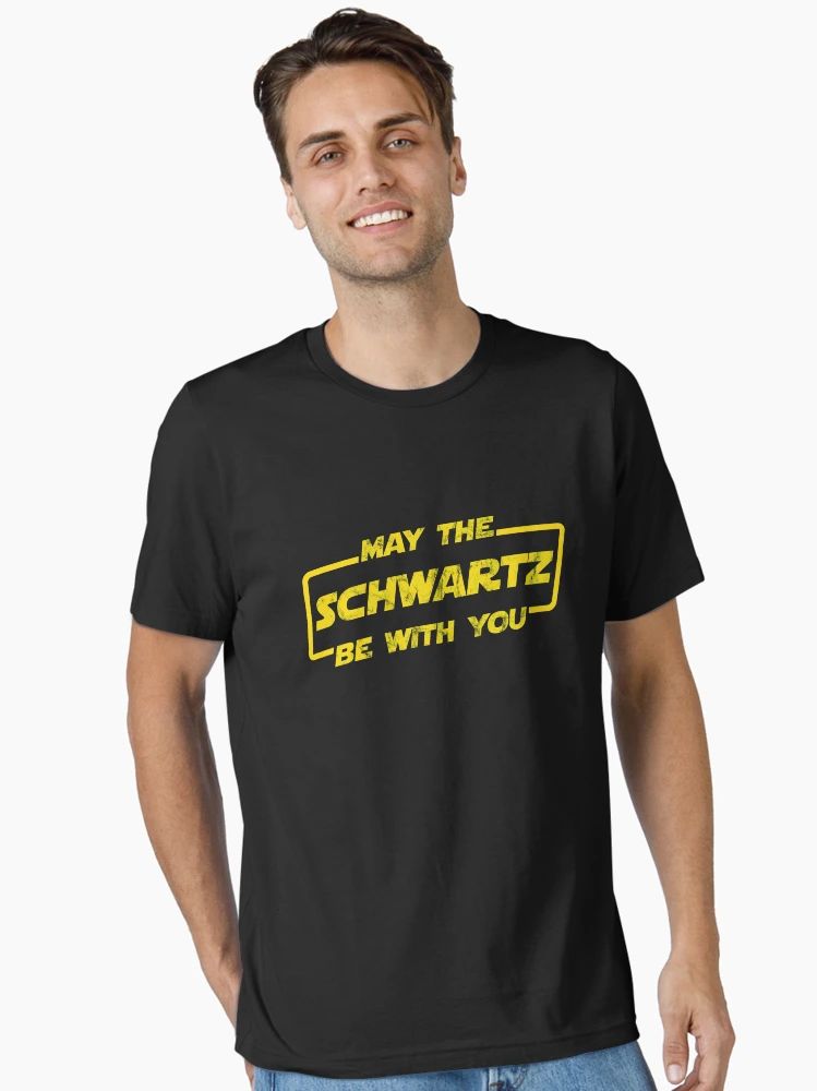 Black Tee with distressed yellow “May The Schwartz Be With You” text in sci-fi parody font.