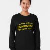 Black sweatshirt with distressed yellow “May The Schwartz Be With You” text in sci-fi parody font.