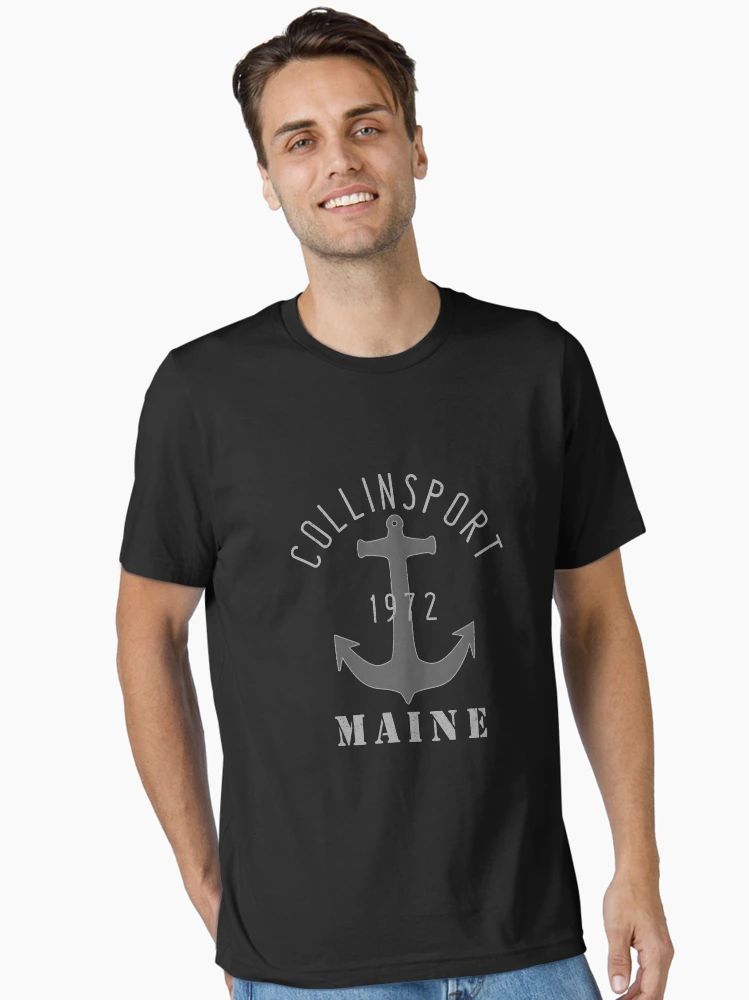 Vintage Nautical Coastal Collinsport Maine 1972 Anchor T-Shirt Black T-Shirt featuring “Collinsport 1972 Maine” text and a grey anchor graphic, modeled by a young man.