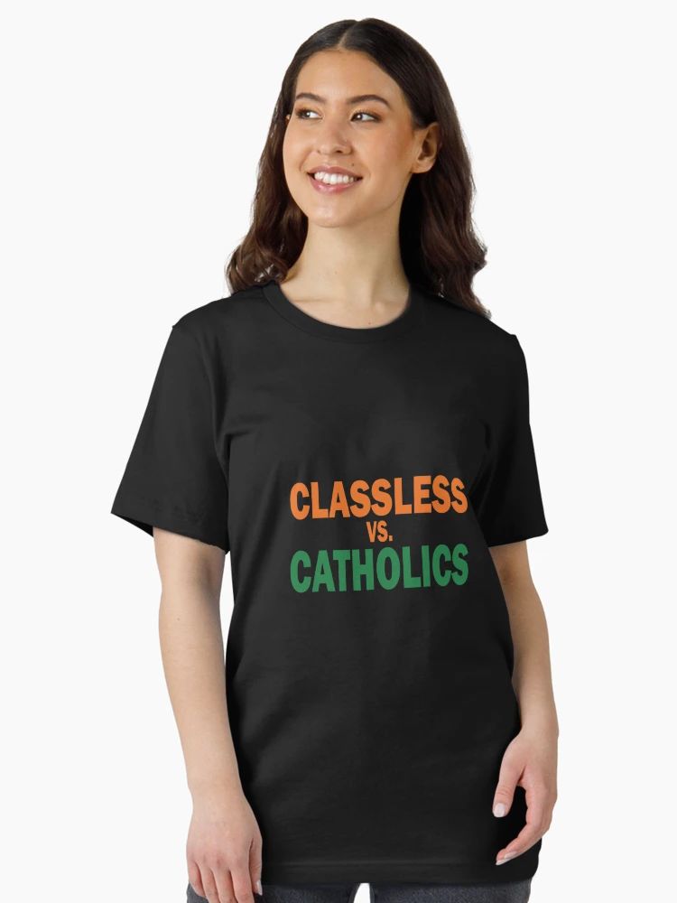 Women Black Tee with bold “Classless vs Catholics” text in orange and green collegiate font, worn by a male model.