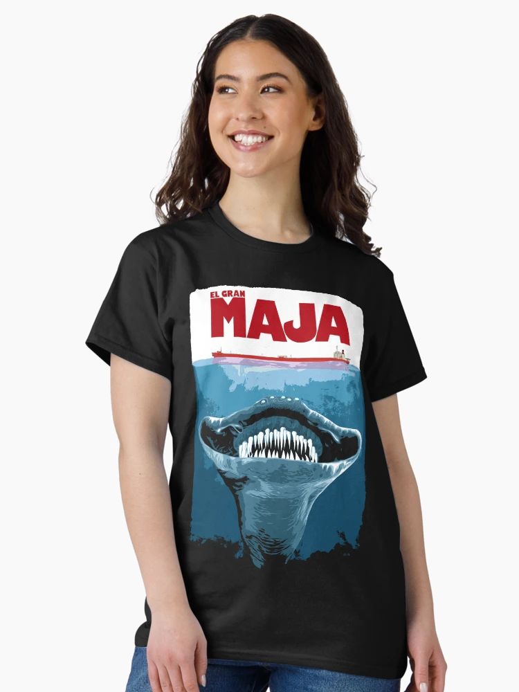 Women Black t-shirt with retro movie-poster design of a giant sea creature and “El Gran Maja” text in bold red letters.