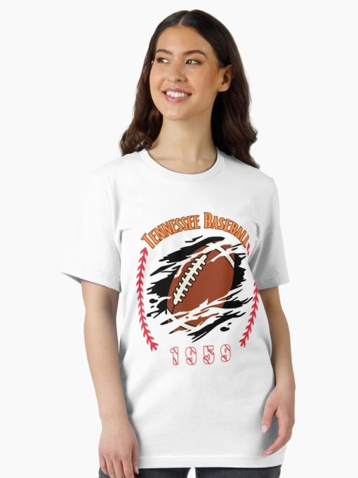 White Tee with a football bursting through a graphic surrounded by red baseball stitches, labeled “Tennessee Baseball 1959,” worn by male model.