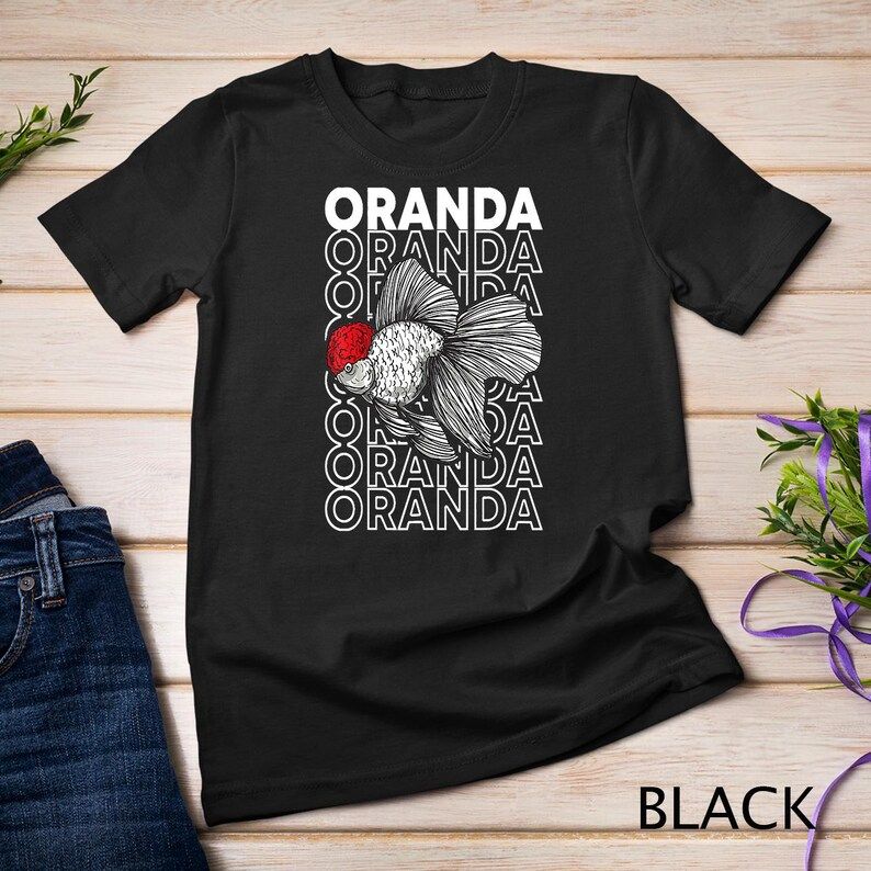 Black t-shirt featuring a detailed Oranda goldfish with a red head and stacked “ORANDA” text in white behind the fish.