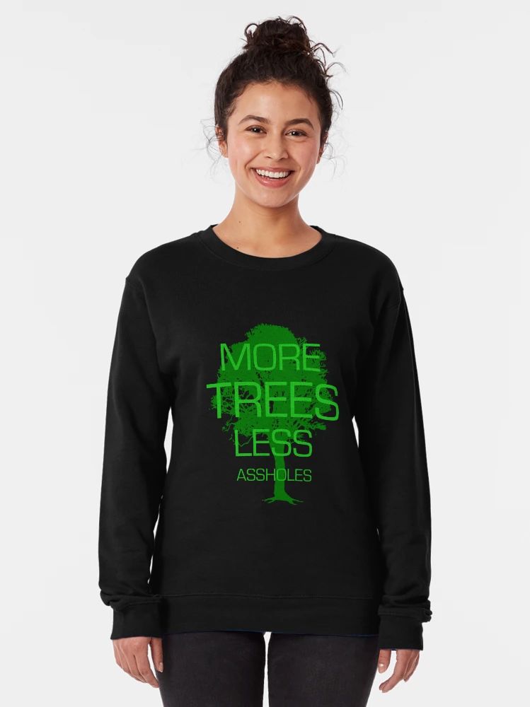 Black sweatshirt with distressed green tree graphic and bold “More Trees Less Assholes” environmental slogan