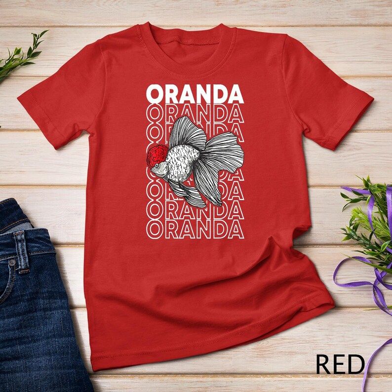 Red t-shirt featuring a detailed Oranda goldfish with a red head and stacked “ORANDA” text in white behind the fish.