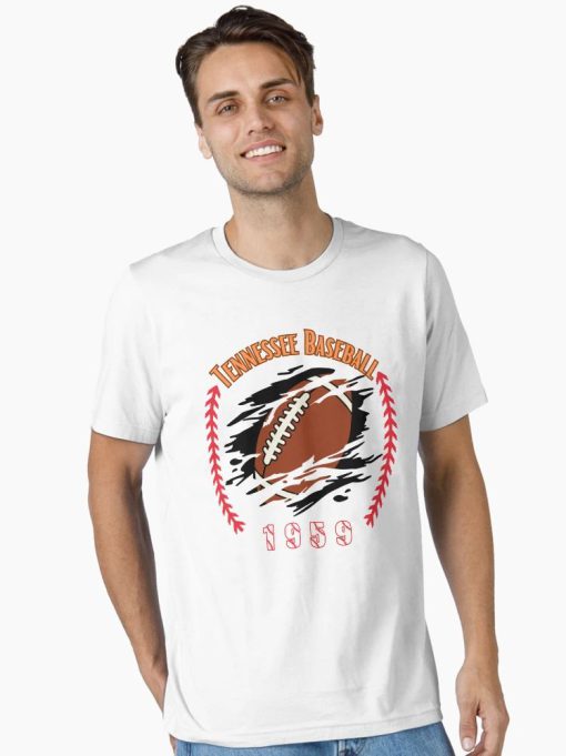 White T-shirt with a football bursting through a graphic surrounded by red baseball stitches, labeled “Tennessee Baseball 1959,” worn by male model.