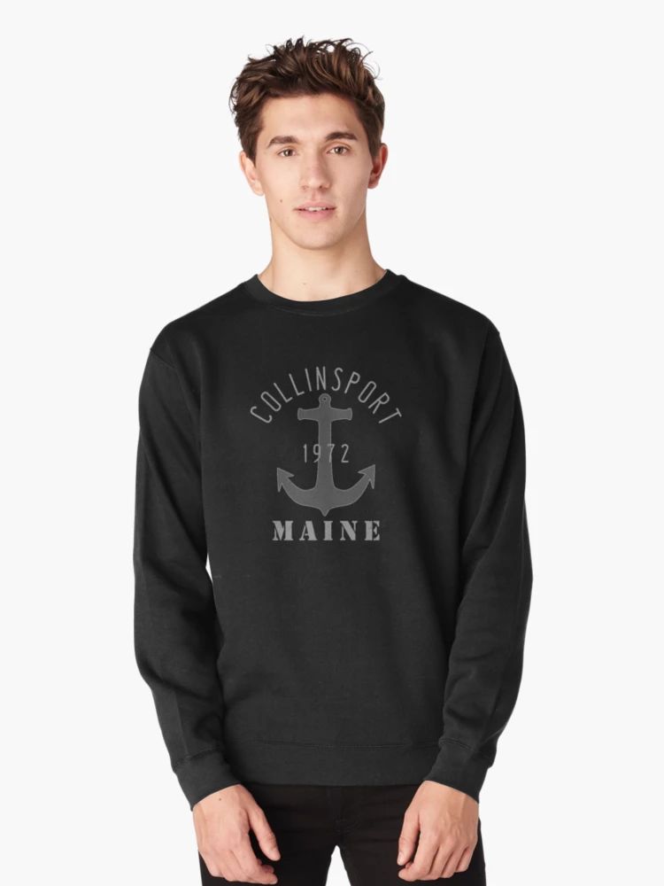 Vintage Nautical Coastal Collinsport Maine 1972 Anchor Sweatshirt Black sweatshirt featuring “Collinsport 1972 Maine” text and a grey anchor graphic, modeled by a young man.