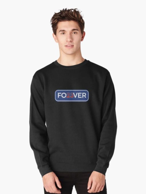 Man wearing black Sweatshirt with “FO23VER” design in blue and white with red 23 — tribute to Cubs legend Ryne Sandberg.