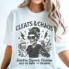 t-shirt with “Cleats & Chaos” skeleton mom graphic holding coffee mug and cleats, with lightning bolt accents.