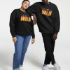 Black Sweatshirt with “Stay Wild” flame-text design in yellow and red, worn by a smiling male model