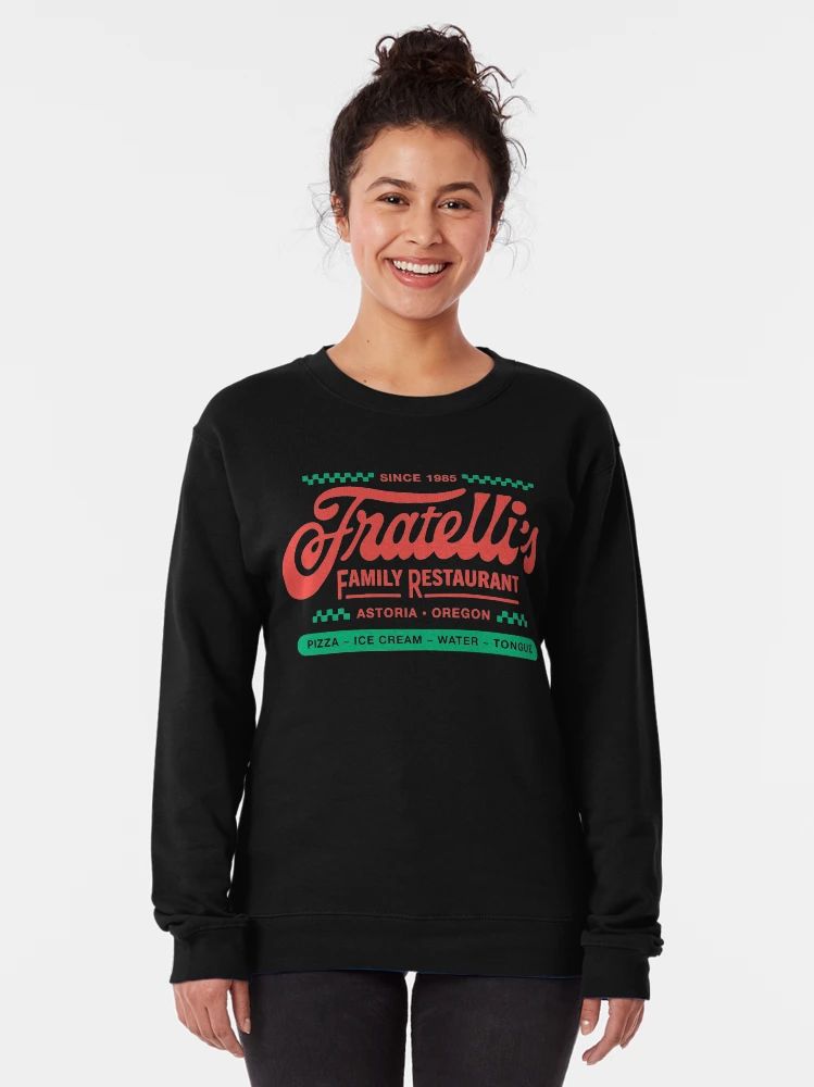 Black Sweatshirt with red and green retro logo reading “Fratelli’s Family Restaurant – Astoria Oregon” and playful food list.