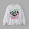 Get In Loser We’re Saving Christmas mashup graphic with skeleton, green creature, and snowman driving in retro holiday design for sweatshirt