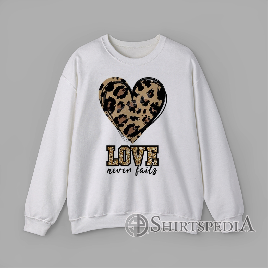 Sweatshirt With Leopard heart with glitter-style leopard LOVE letters and ‘never fails’ script graphic design