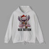 Six Seven Christmas Stitch Alien Hoodie Cartoon pink alien creature wearing Santa hat and scarf making hand sign with text Six Seven Christmas graphic Hoodie
