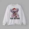Six Seven Christmas Stitch Alien Sweatshirt Cartoon pink alien creature wearing Santa hat and scarf making hand sign with text Six Seven Christmas graphic Sweatshirt