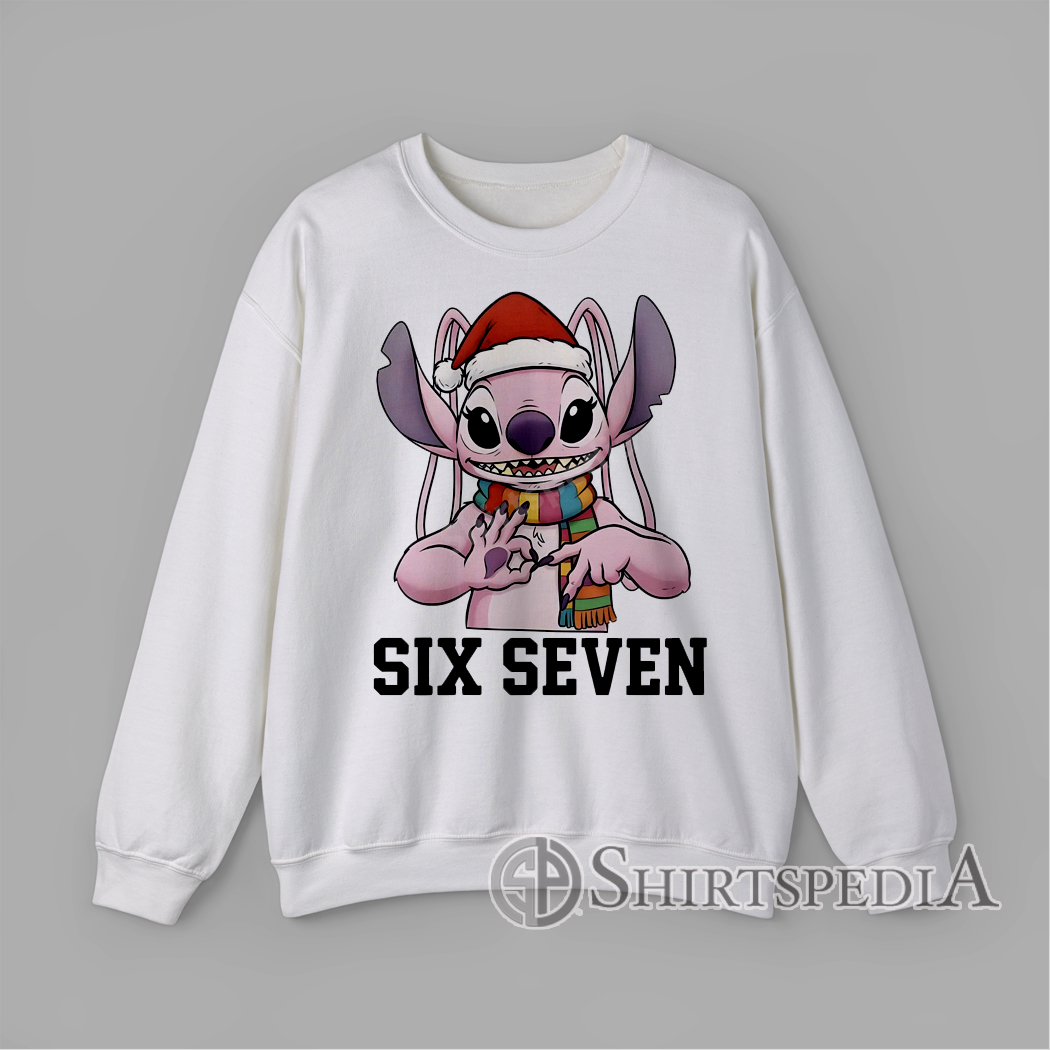Six Seven Christmas Stitch Alien Sweatshirt Cartoon pink alien creature wearing Santa hat and scarf making hand sign with text Six Seven Christmas graphic Sweatshirt