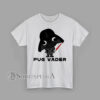 Graphic T-shirt with a cartoon pug wearing a black villain helmet and holding a red bone-shaped lightsaber with the text “Pug Vader