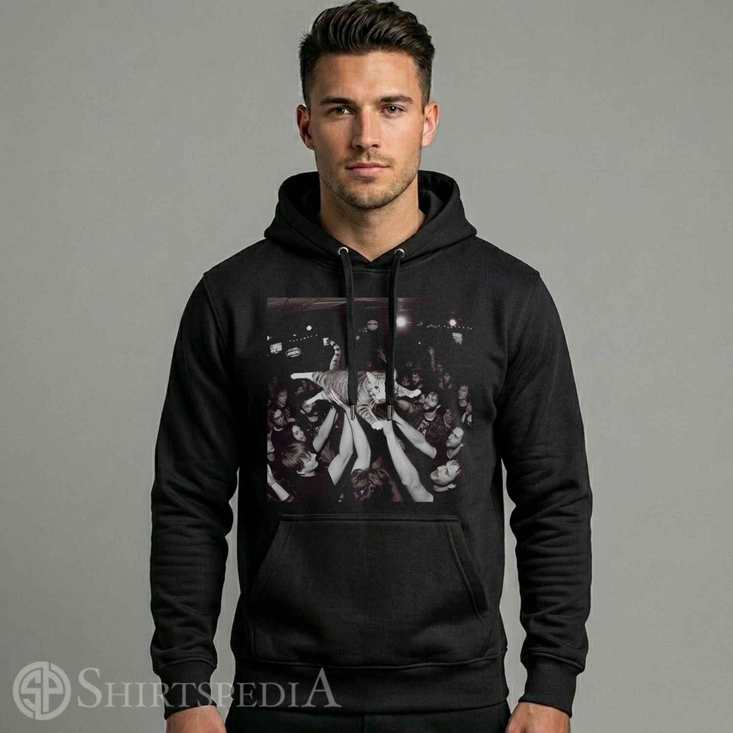Mens Heavyweight black streetwear hoodie with an adjustable drawstring hood, displaying a large central graphic of a cat crowd surfing at a rock concert.