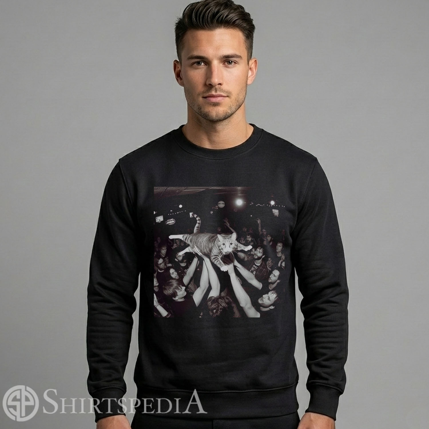 Mens black crewneck pullover sweatshirt featuring a large central graphic of a crowd-surfing cat at a live rock concert.