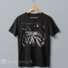 black streetwear t-shirt featuring a funny cartoon graphic of an ecstatic cat crowd surfing over a hands-raised concert audience.